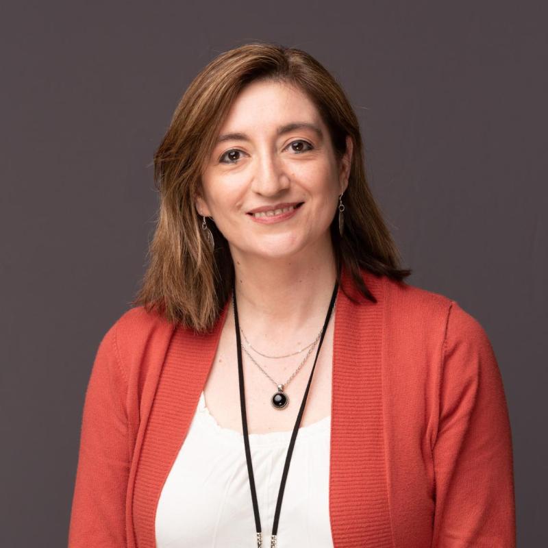 image of Paulina Larenas in an orange cardigan