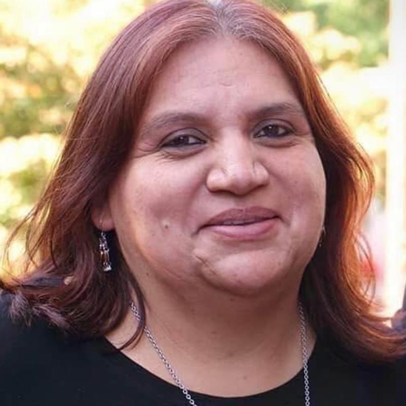 Image shows a person smiling