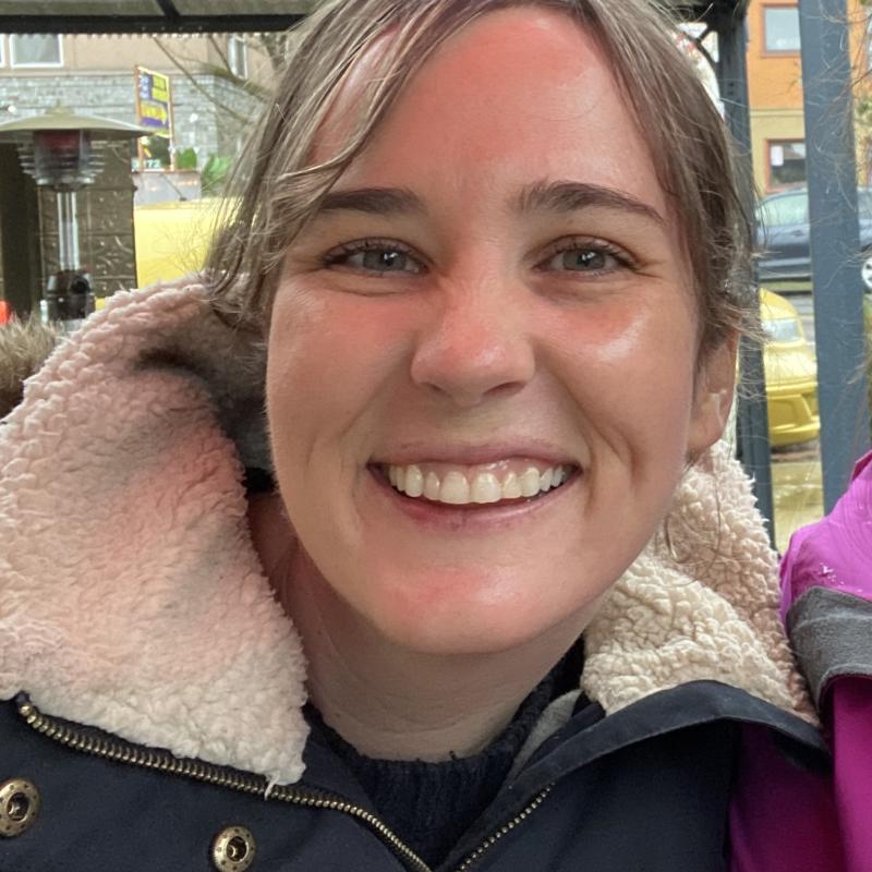 Image shows a person smiling