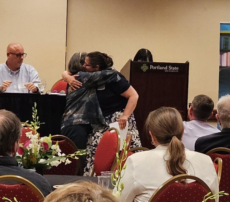 Frances and Sarah hug during the PSU award ceremony