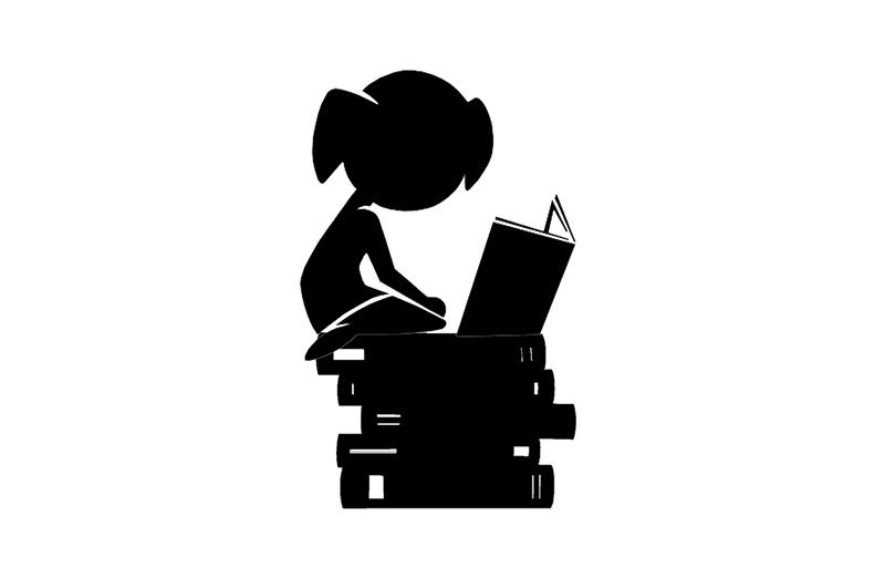 Silhouette of a child sitting on a stack of books, reading