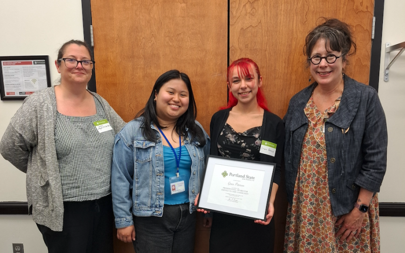 OKT members Sarah, Nina, and Wendy, stand next to Grace Peterson with her Undergraduate Presidential Award